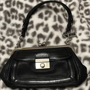 Coach Black Leather Clutch with Silver Accents.  Vintage kiss lock design.